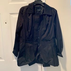 Black satin dressy jacket with buttons and pleats. Looks really trendy on.